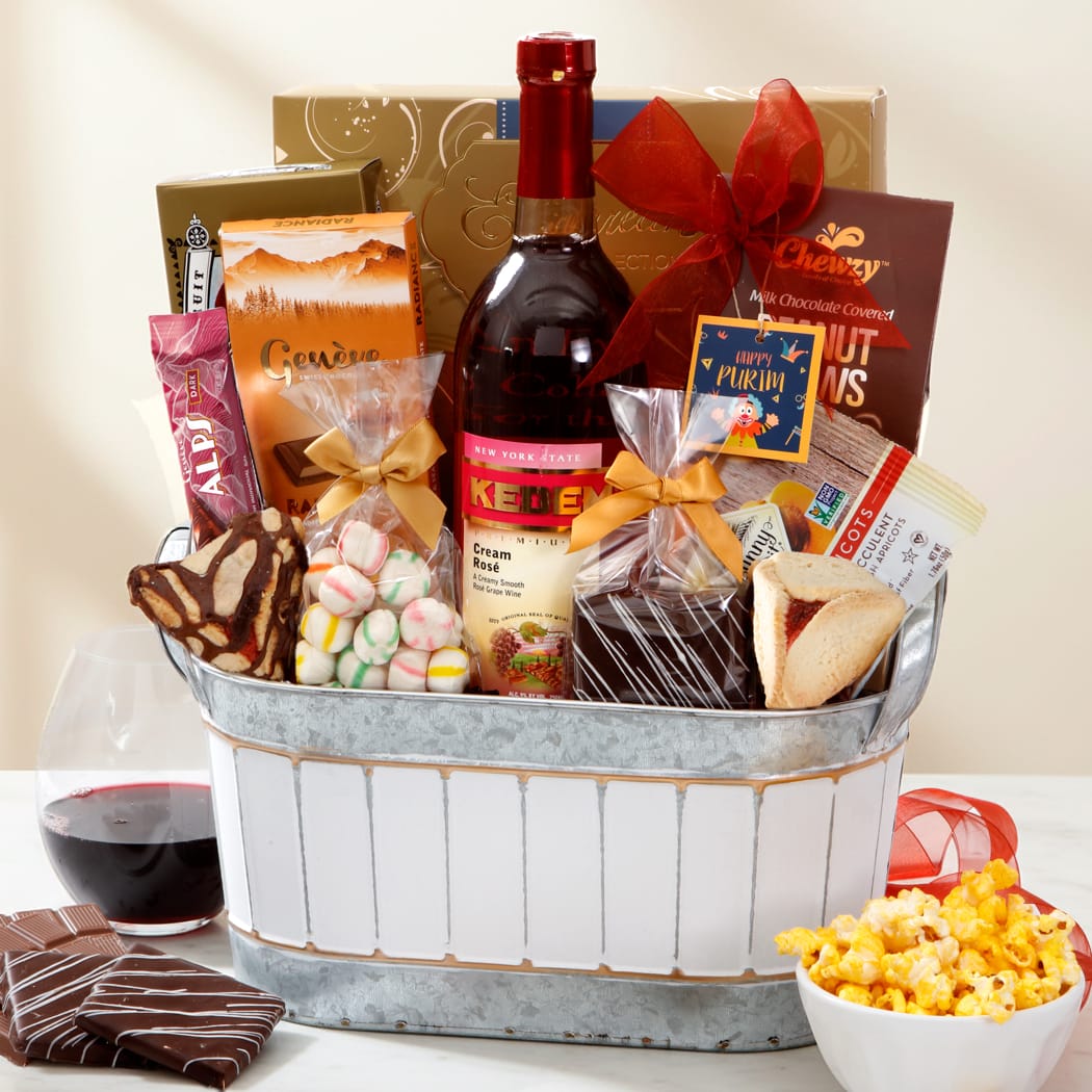 Luxurious gourmet gift basket with wine, chocolates, snacks, and treats for festive celebrations.