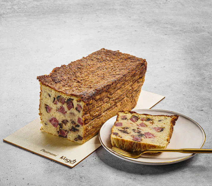 Rich fruitcake with dried fruits and nuts, classic holiday dessert, perfect for festive occasions.