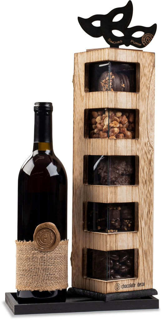 Dark red wine bottle with burlap wrapped label beside a wooden box containing assorted chocolates and nuts.