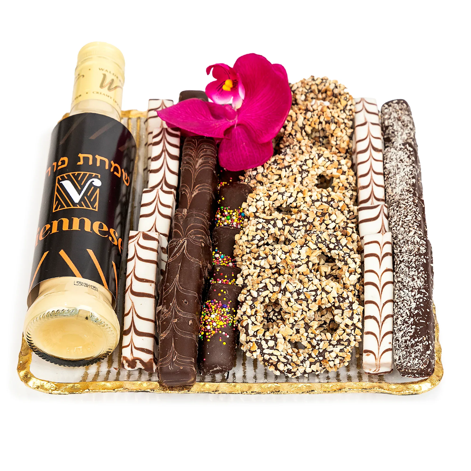Assorted chocolate wafer rolls with a pink orchid flower on golden tray.
