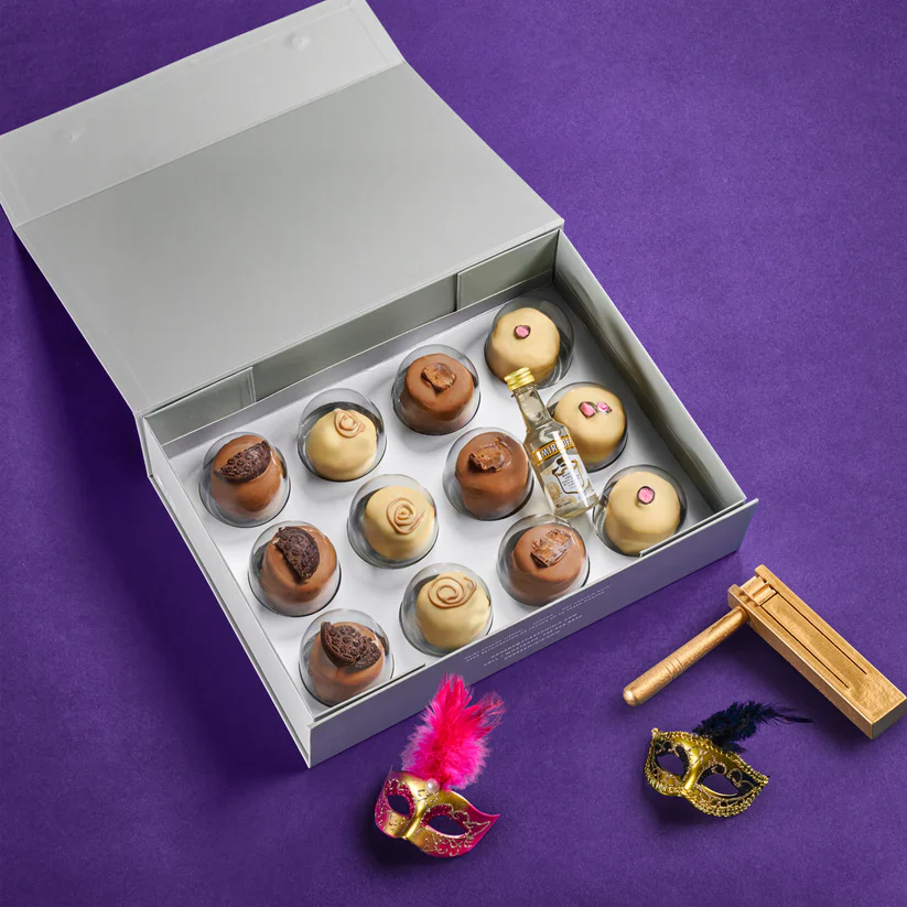 Delicious assorted chocolates in a gift box with Mardi Gras masks and a chocolate hammer. Perfect for celebrations and special occasions.