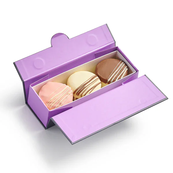 Assorted chocolates in purple box with pink, white, and brown flavors.