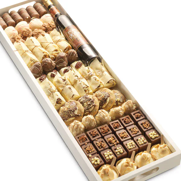 Assorted chocolates including truffles, pralines, and cream-filled confections in a white box.