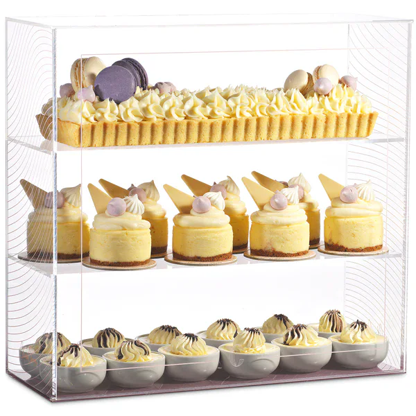 Deluxe glass display case showcasing a variety of beautifully decorated desserts, including cakes, t.