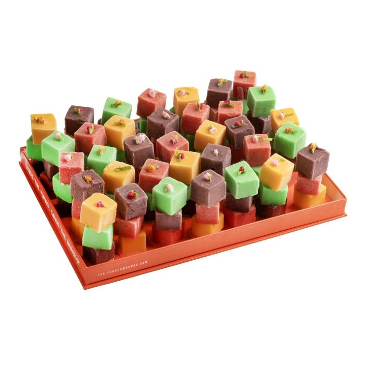 Delicious Turkish delight cubes with assorted flavors and vibrant colors in a tray.