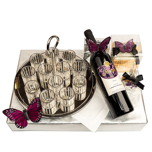Elegant gift set with wine bottle, glasses, and butterfly decorations.